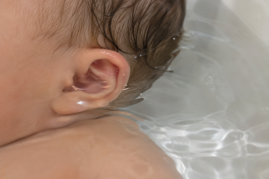 babys ear in bath water