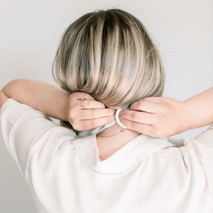 GIF of mother using the Lift, Unsnap Wrap Towel